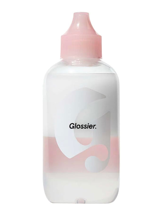 Glossier Milky Oil dual-phase remover bottle dispensing for easy makeup removal