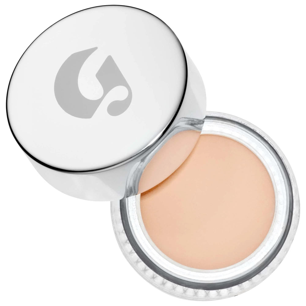 Glossier Stretch Concealer G10 packaging close-up highlighting compact design and shade range