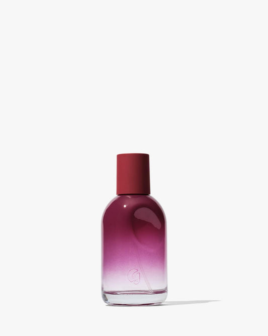 Glossier You Reve bottle with thumbprint indent, a personal scent enhancer for intimate wear.