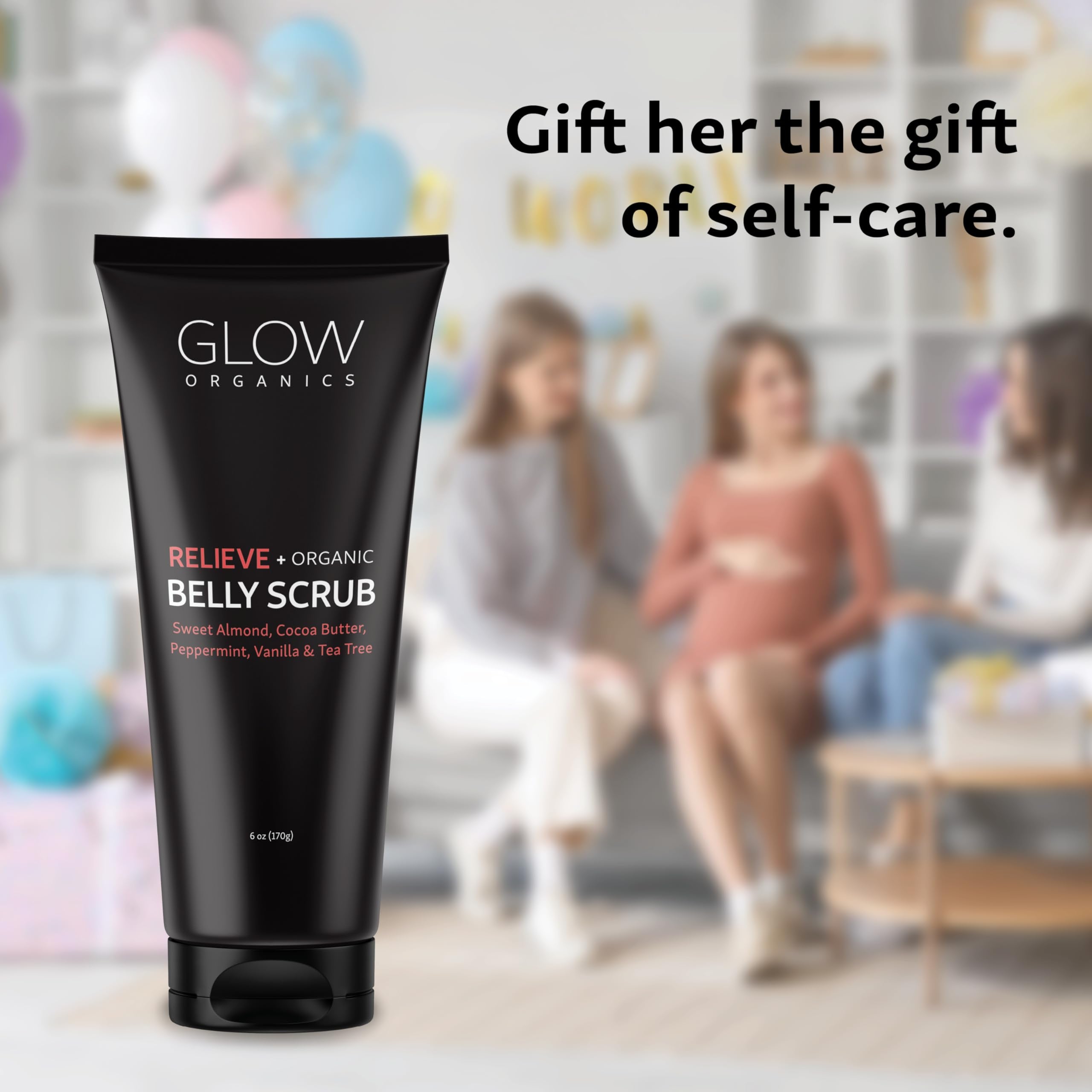 Applying Glow Organics belly scrub during daily routine for smooth skin.