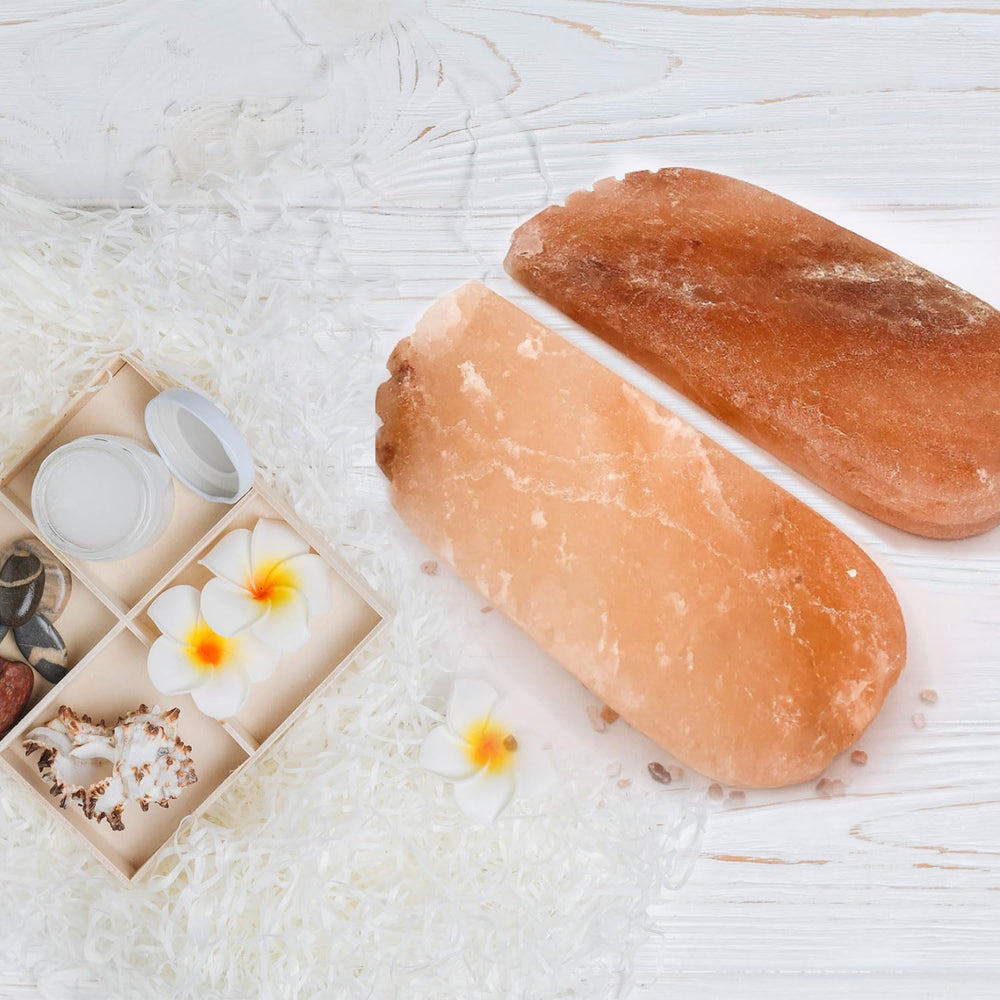 Glowyn Pink Himalayan Salt Detox Foot Block 2-pack resting on a spa mat for natural foot care.