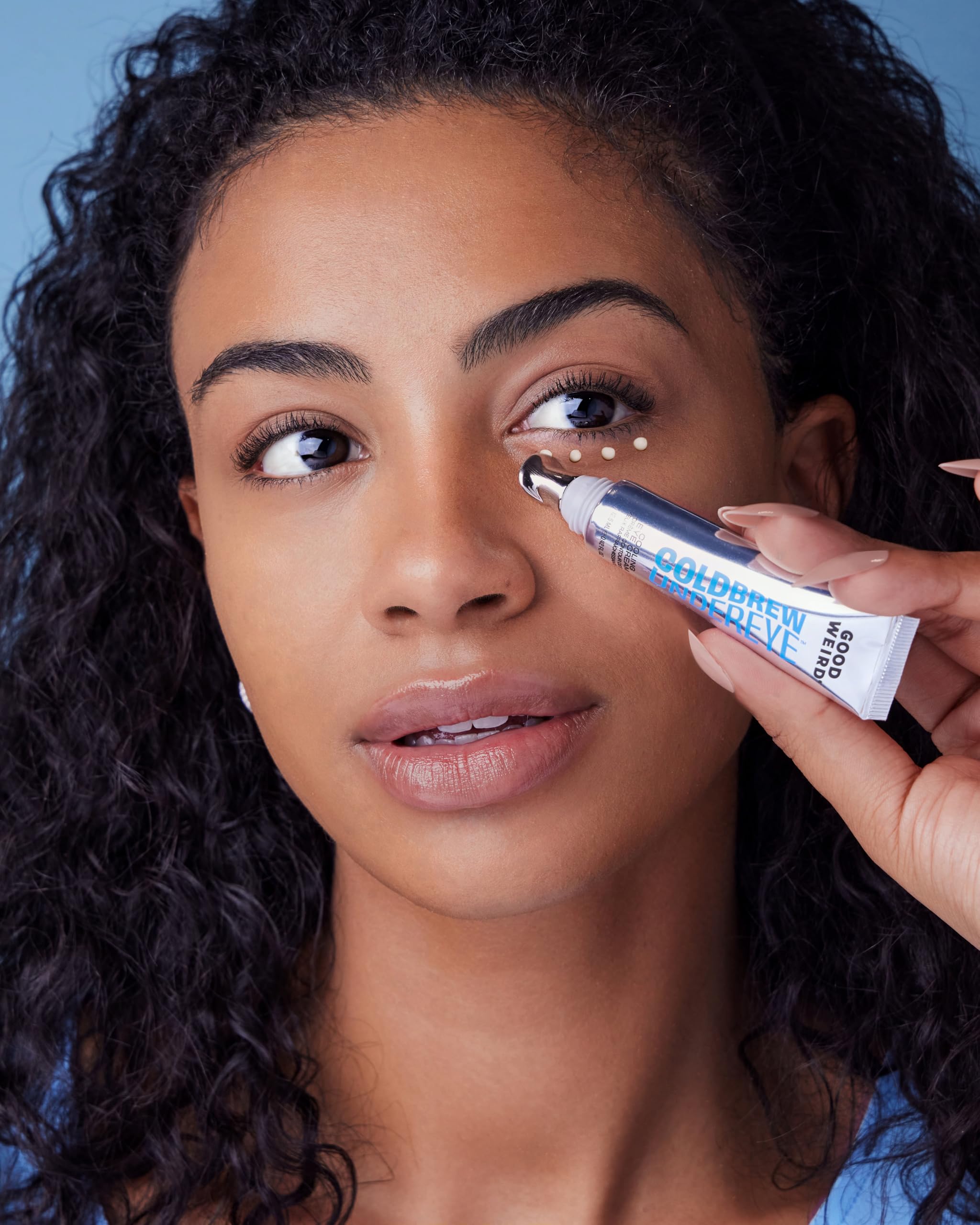 GOOD WEIRD Caffeine Eye Serum pump-shot demonstrating quick absorption and cooling sensation.