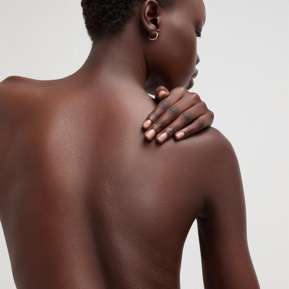Goop Beauty Body Butter ingredients banner features botanicals.