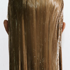 goop Beauty Hair Mask bottle with pump illustrating lightweight, frizz-fighting conditioning.
