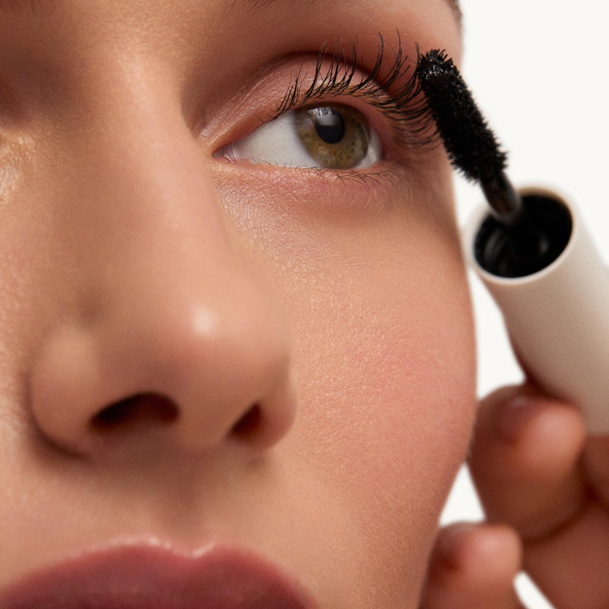 goop Featherlash applicator used on upper and lower lashes for balanced definition.