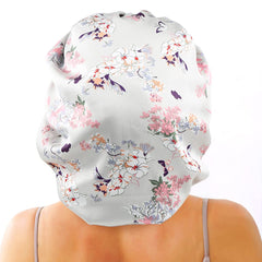 Model wearing the satin bonnet to protect long hair during sleep and daily activities