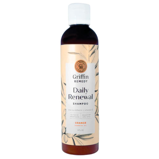 Griffin Remedy Daily Shampoo bottle pour showcasing natural oils for balanced scalp and soft hair
