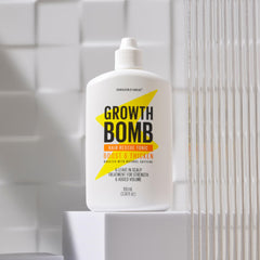 Growth Bomb hair strands closeup highlights strengthened, non-greasy formula across textures.