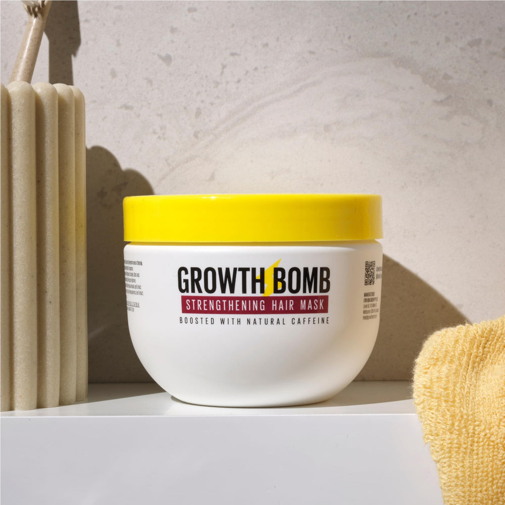 Creamy texture of GROWTH BOMB mask ready to nourish hair