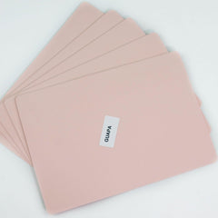 Guapa pad beside ruler showing 20.8 x 14.5 cm size for scale