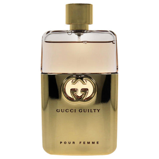 Gucci Guilty Pour Femme bottle close-up showing elegant label.