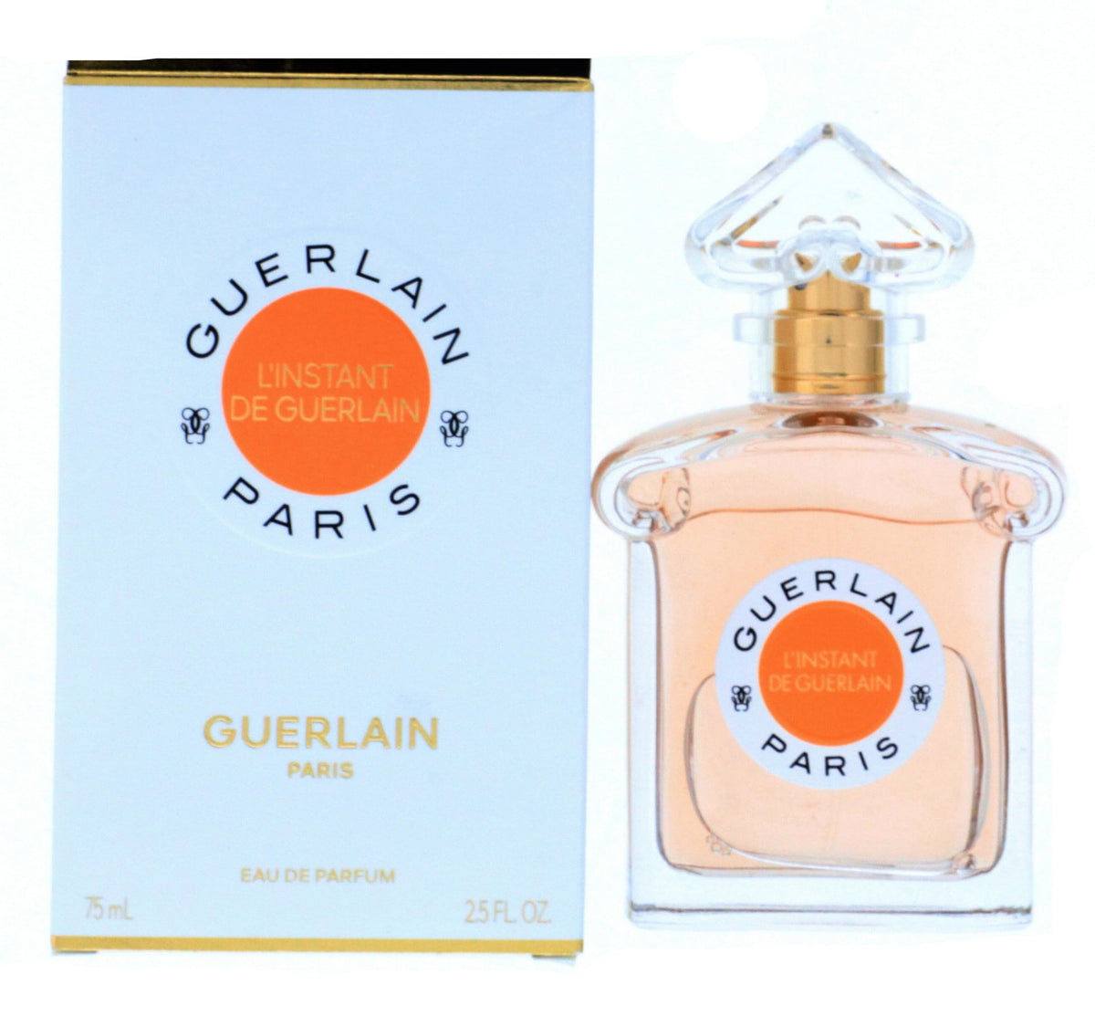 Guerlain L'Instant bottle close-up highlights amber floral notes for evening wear.