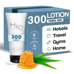 H2O Therapy Lotion travel-size bottle on hotel shelf for convenient guest use.