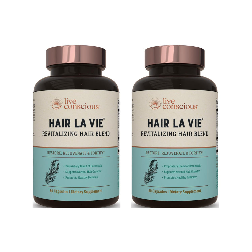 Hair La Vie Revitalizing Blend bottle showcases capsules for hair health.