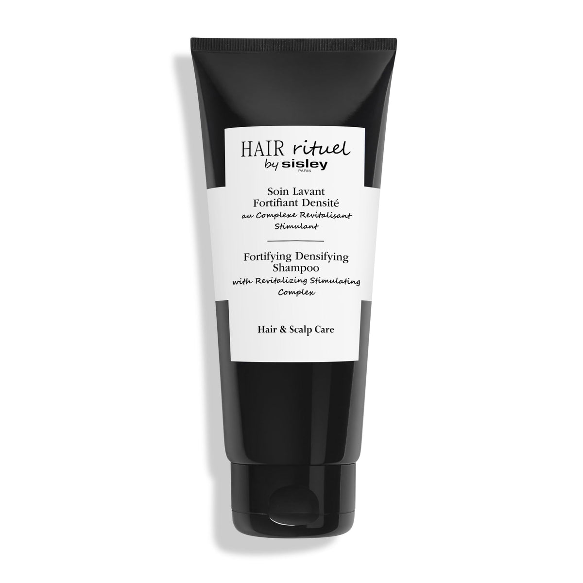 Hair Rituel by Sisley fortifying shampoo bottle for visibly stronger, thicker-looking hair.