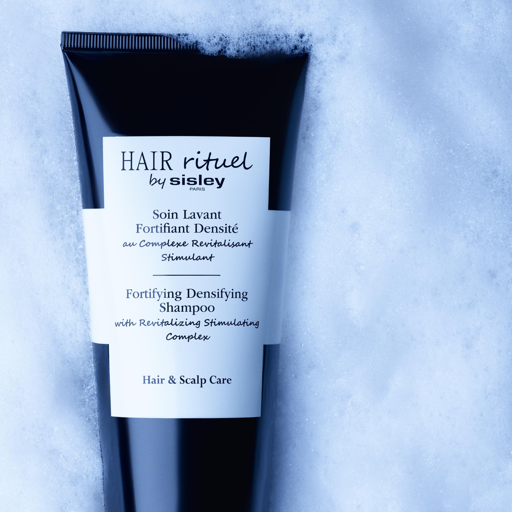 Hair Rituel by Sisley stimulating complex illustration showing scalp vitality.