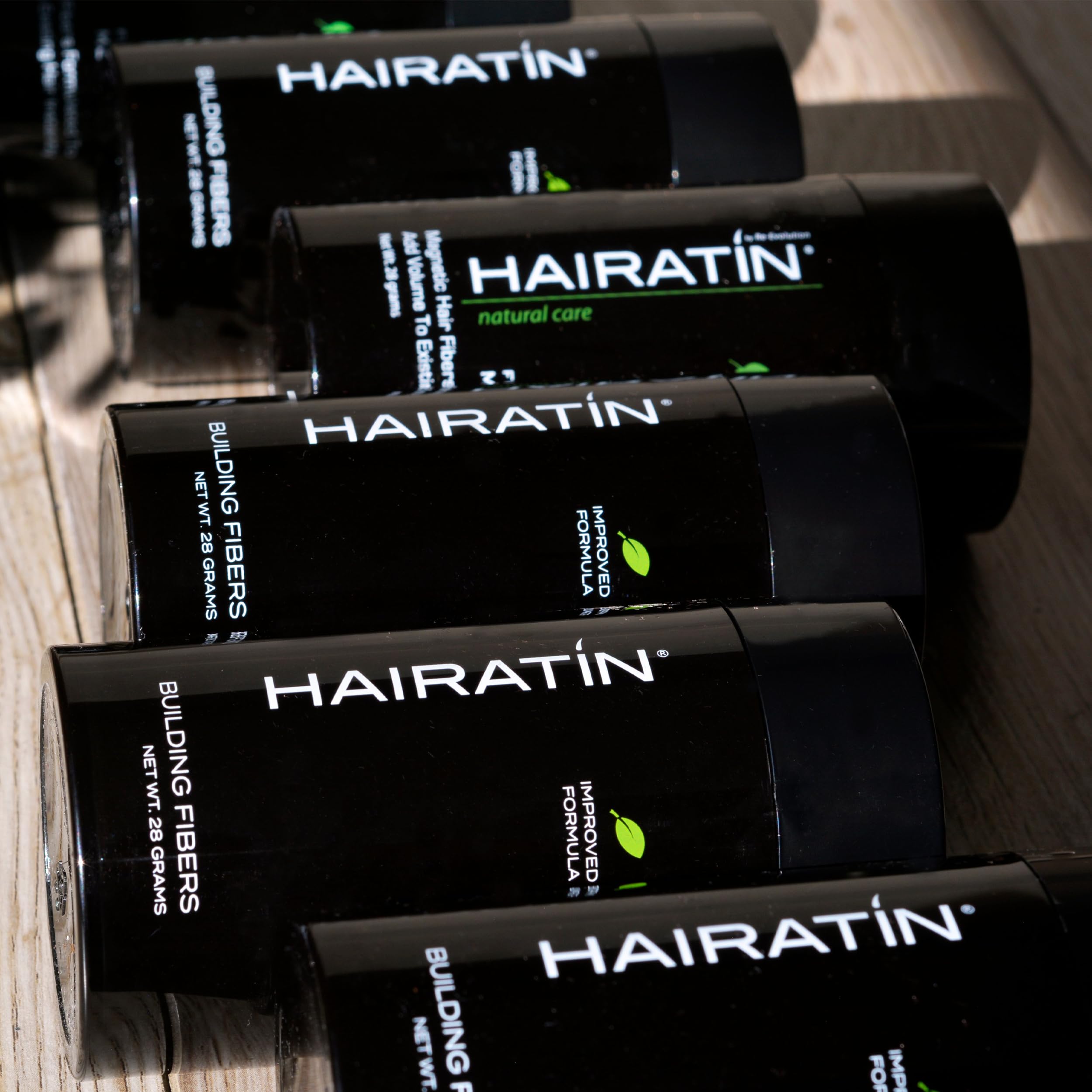 HAIRATIN user brushing hair after applying for a finished style.