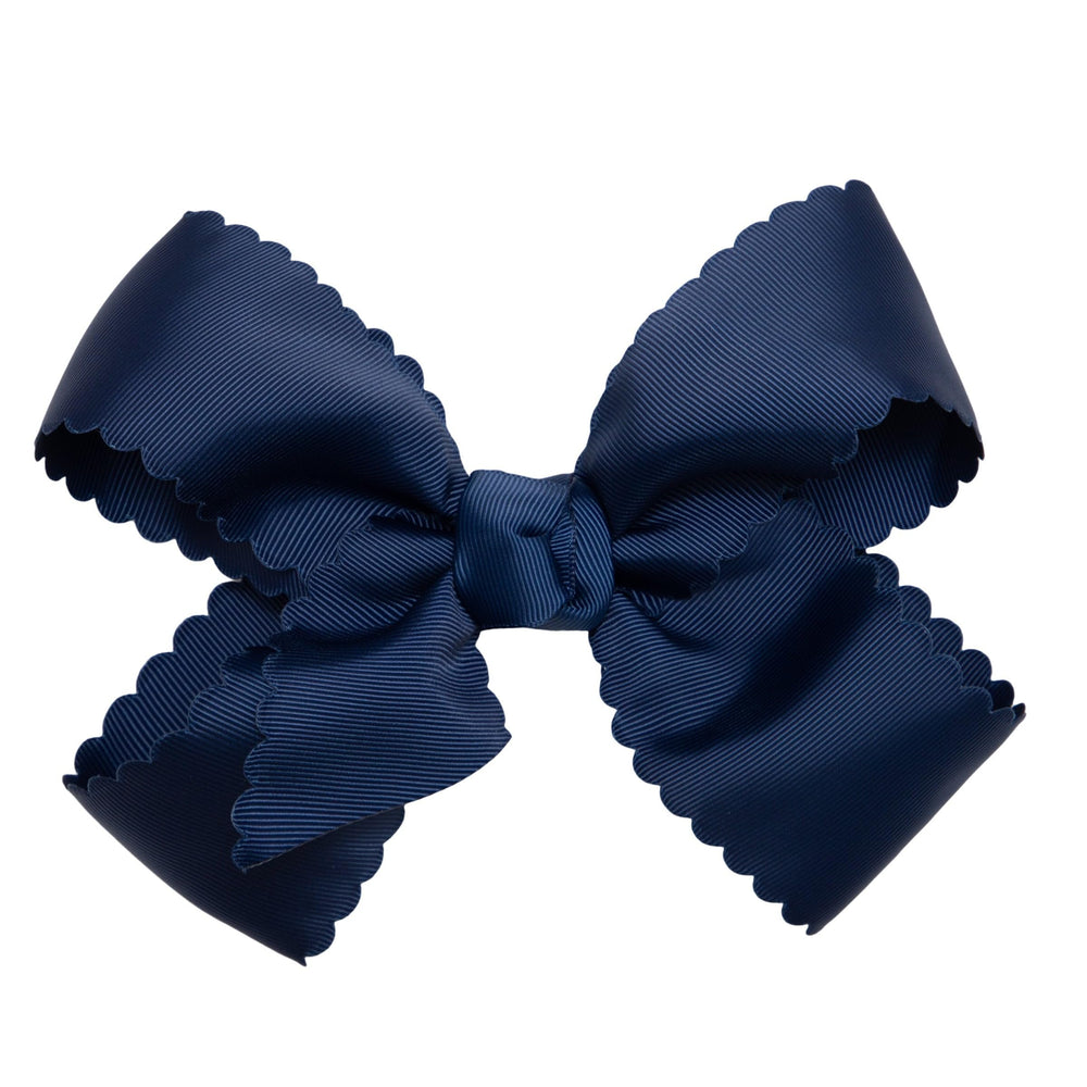HAIRBOWS navy grosgrain scalloped-edge bow on clip adds a polished look.