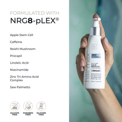 Hairmax Acceler8 bottle pouring spray during application on the scalp