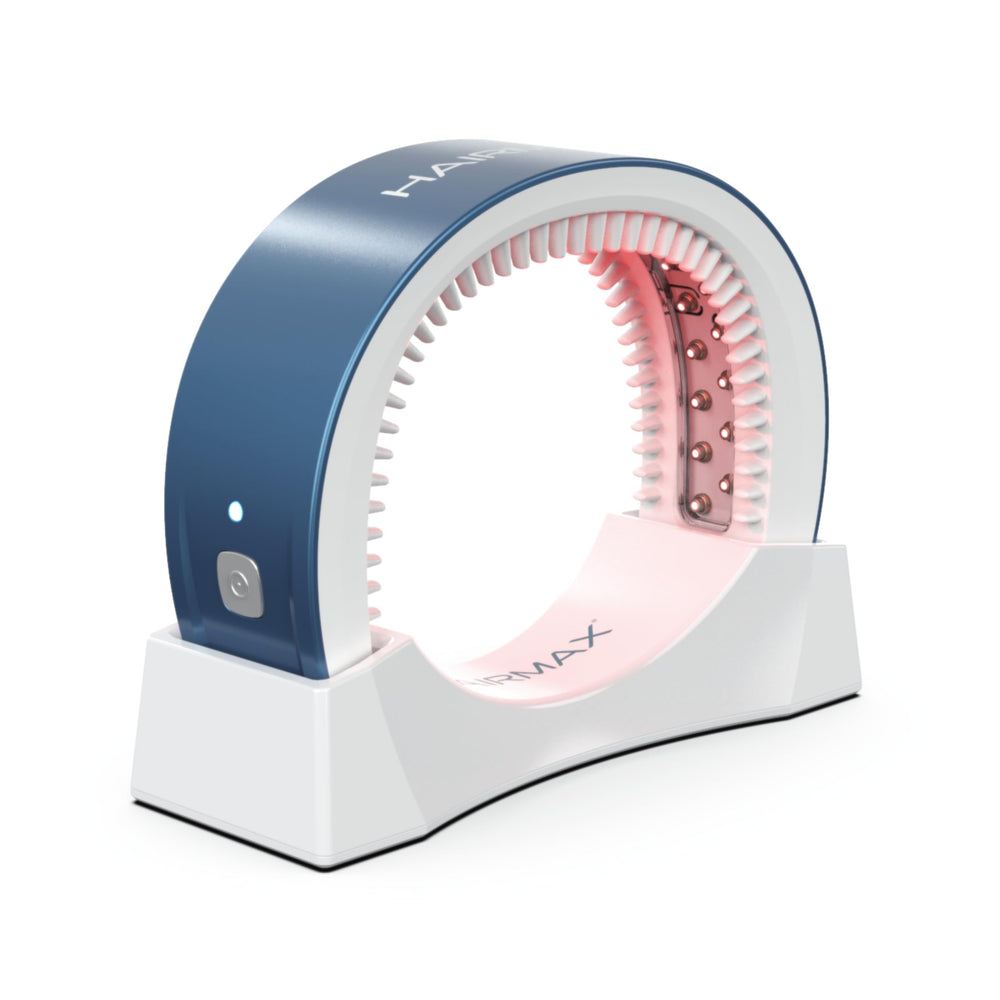 HairMax Laser Band 41 worn on the head for at-home red light therapy convenience.