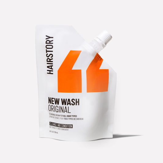 Hairstory New Wash Original Refill bottle front shows compact, convenient cleansing.