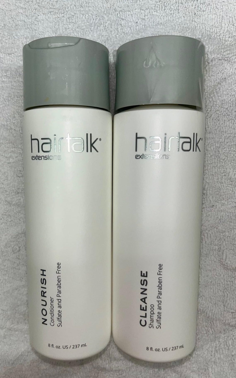 Hairtalk Cleanse Shampoo bottle pouring for extensions