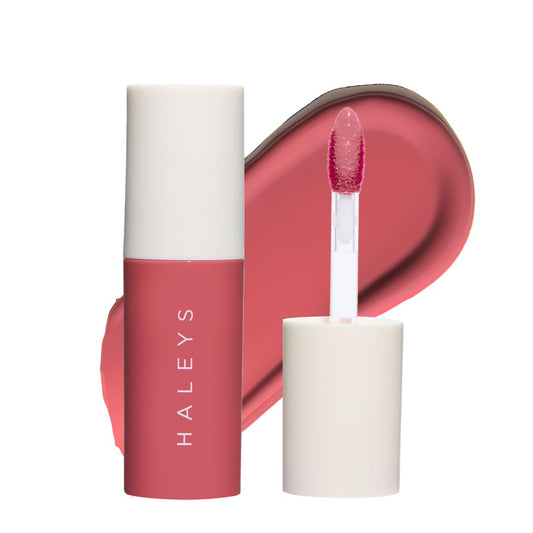 HALEYS Re-dew Lip Gloss bottle application for hydrating shine that lasts.