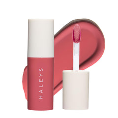 HALEYS Re-dew Lip Gloss bottle application for hydrating shine that lasts.