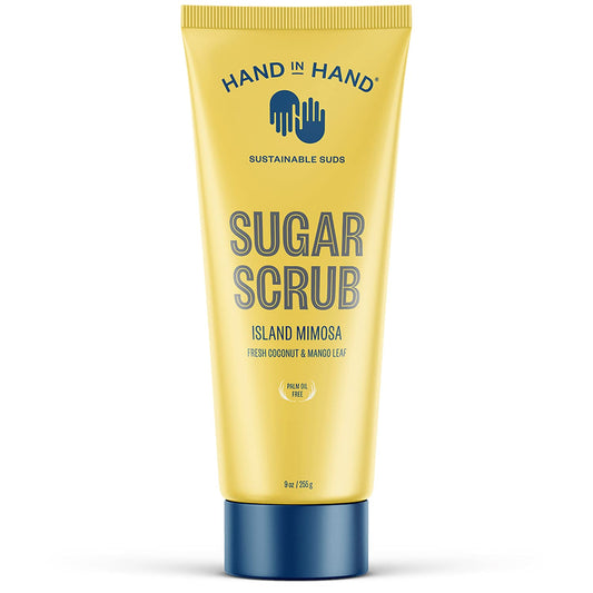 Hand in Hand Sugar Scrub bottle closeup, tropical Island Mimosa scent enhances shower routine and smooths skin.