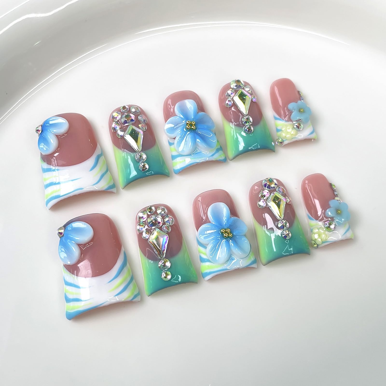 10Pcs Blue Flower Press On Nails in duckbill shape for comfortable all-day wear.