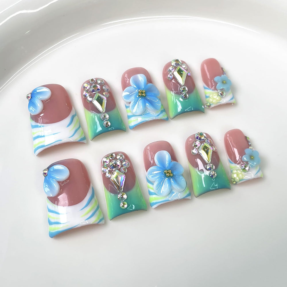 10Pcs Blue Flower Press On Nails in duckbill shape for comfortable all-day wear.