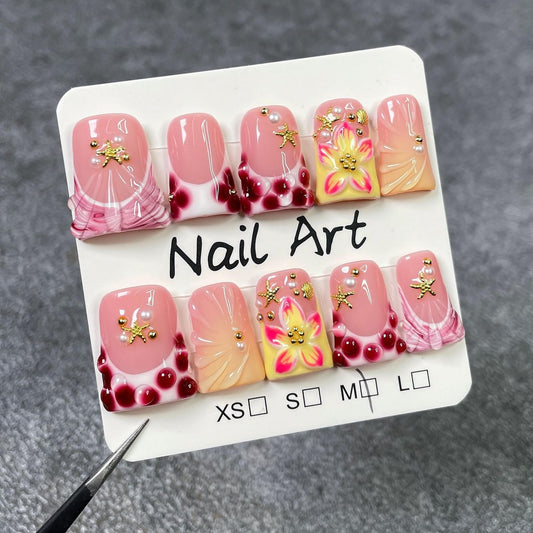 Handmade Flower Press-on Nails show polka-dot French tip on short nails.