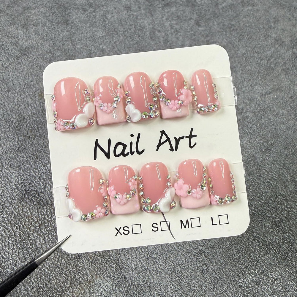 Handmade nails in a short square shape with pink French tip for daily wear