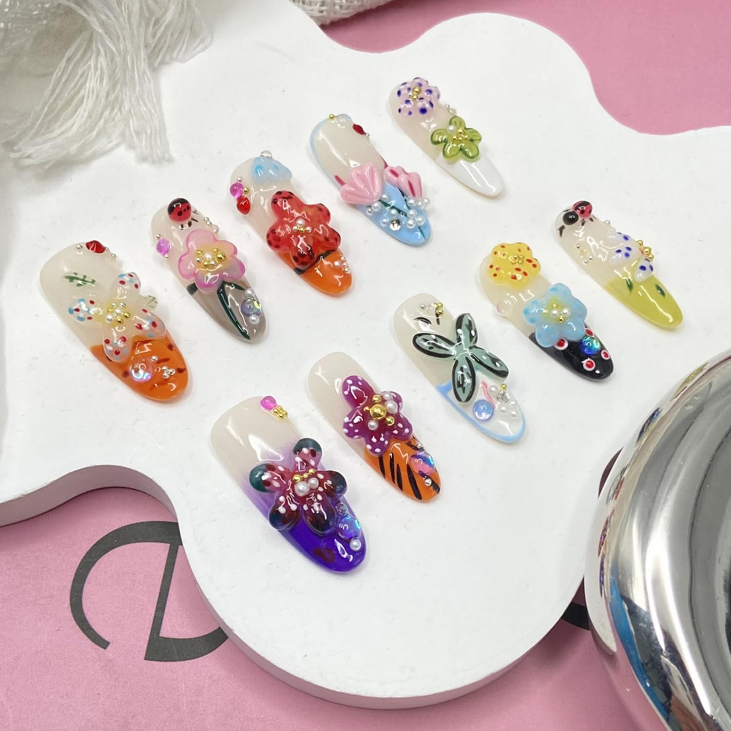 Handmade press-on nails showcasing glossy rhinestones detail for chic sparkle.