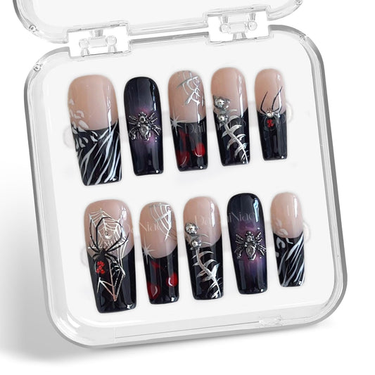 Handmade press-on nails with spider web full-cover design for dramatic Halloween style.