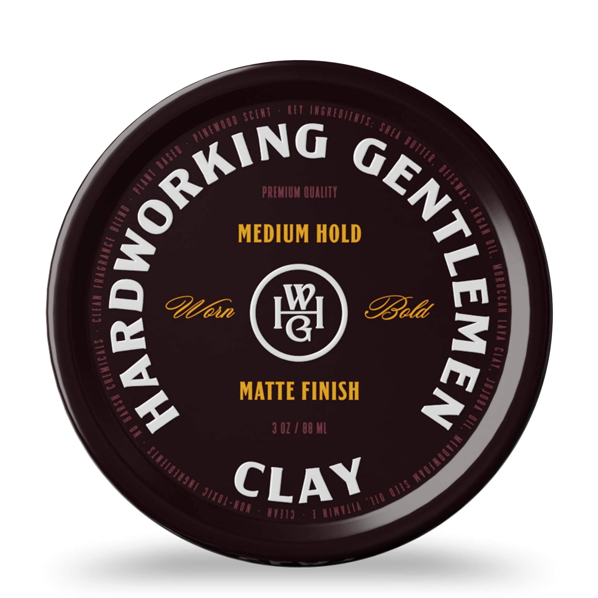 Hardworking Gentlemen medium hold hair clay bottle in hand for easy application