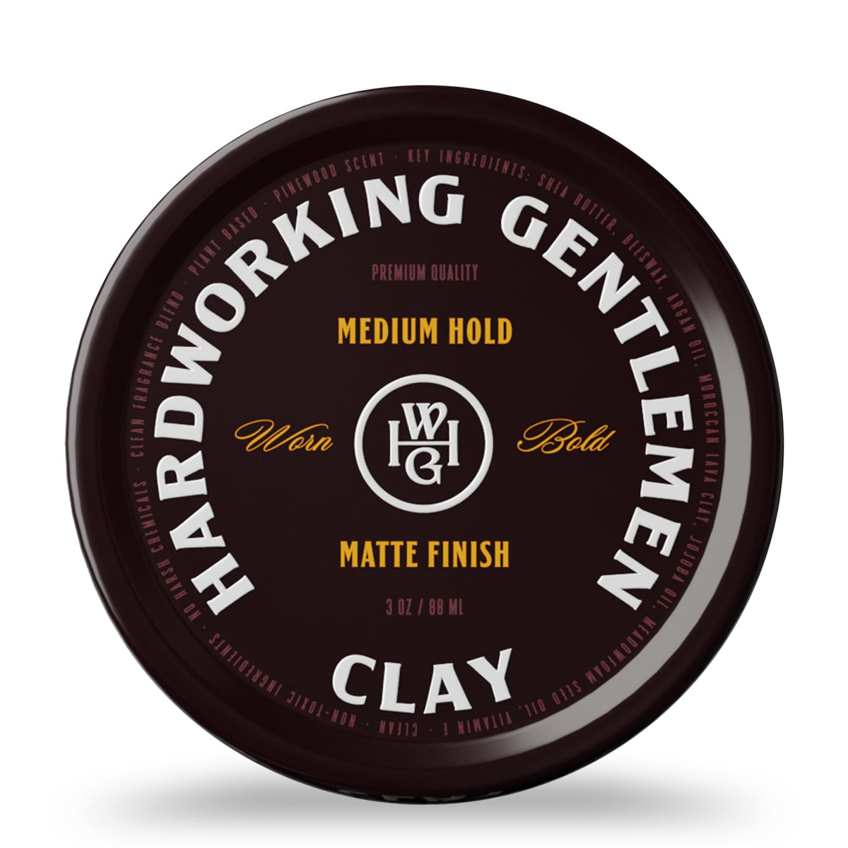 Hardworking Gentlemen medium hold hair clay bottle in hand for easy application