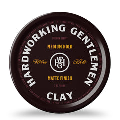 Hardworking Gentlemen medium hold hair clay bottle in hand for easy application