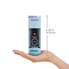 HASK Argan Repairing Hair Oil 2-pack on a dresser