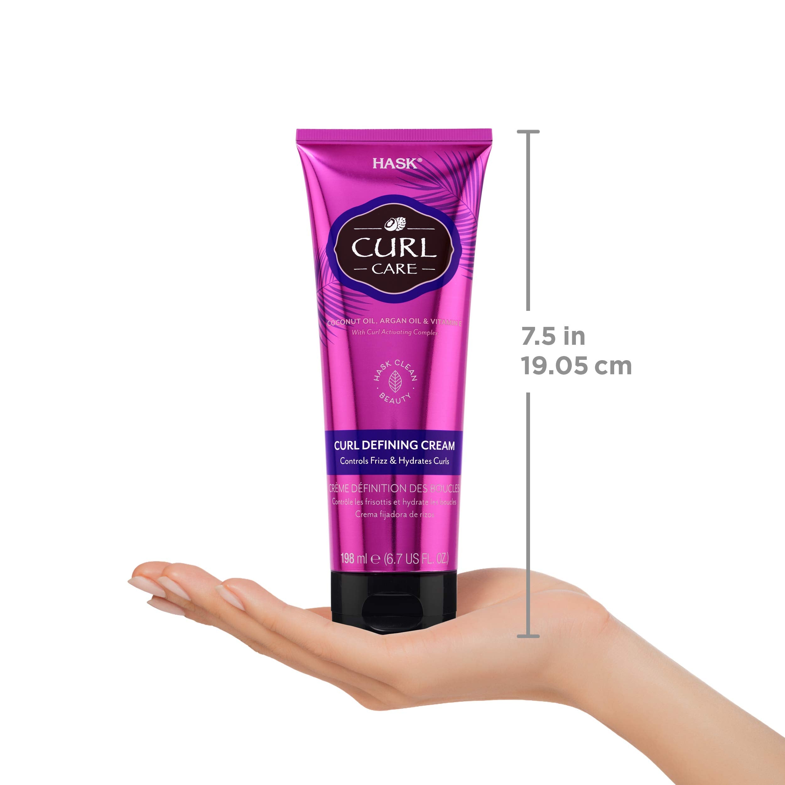 HASK applying hair cream on damp curls for smooth definition.