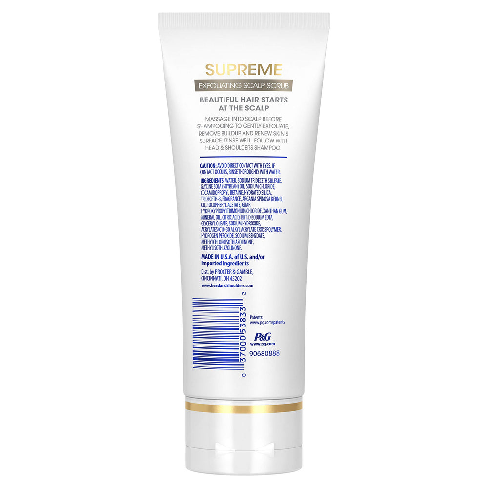 Head & Shoulders Supreme exfoliating scrub being massaged onto the scalp before shampoo.
