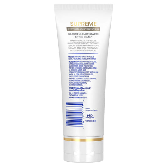 Head & Shoulders Supreme exfoliating scrub being massaged onto the scalp before shampoo.