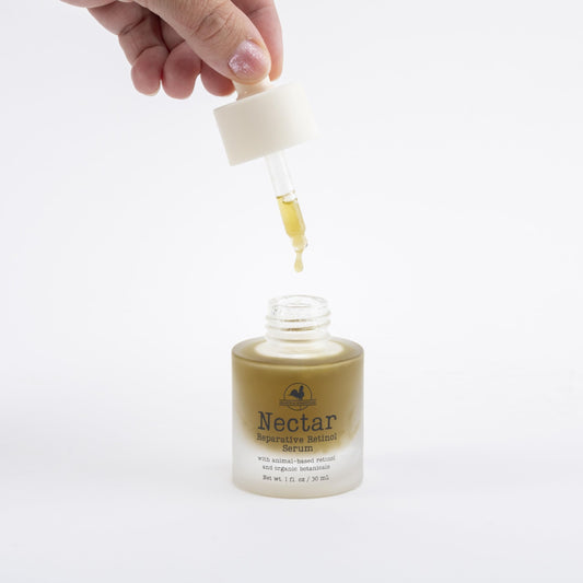 Hearth and Homestead Nectar Serum dropper delivering precise, lightweight hydration.