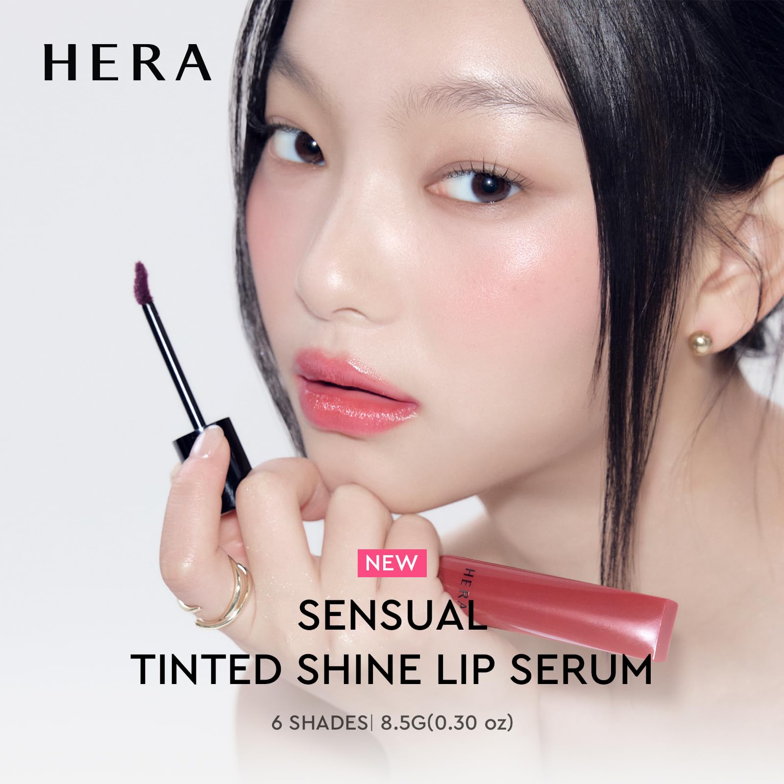 HERA Sensual Tinted Shine Lip Serum Sundaze close-up highlights a wet-gloss look.