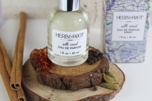 Herb & Root Amber Wood Spice cap highlights premium packaging and spicy-warm notes