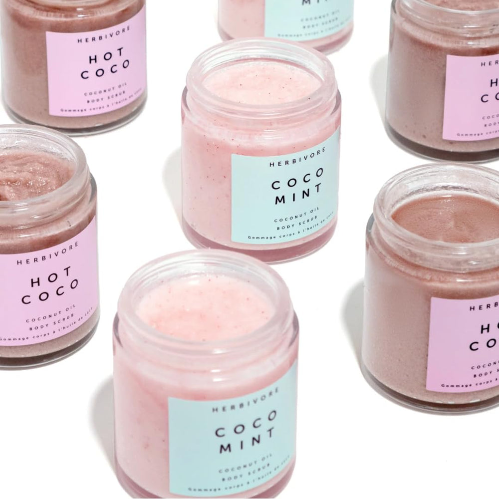 HERBIVORE Coco Mint Body Scrub texture closeup shows creamy oils and gentle exfoliation.