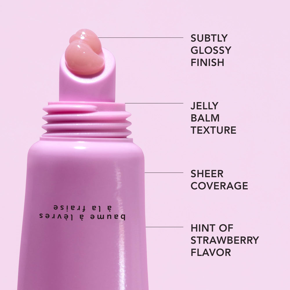 HERBIVORE Dream Jelly lip balm application on lips provides a plump-looking sheen.