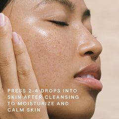 HERBIVORE Emerald Facial Oil packaging on vanity