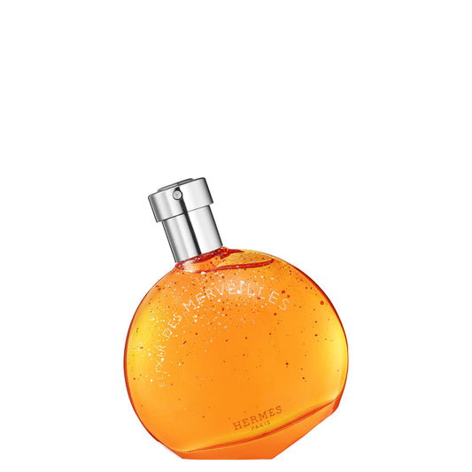 Hermès Eau des Merveilles Elixir bottle close-up, evoking warm, sophisticated scent for special occasions.