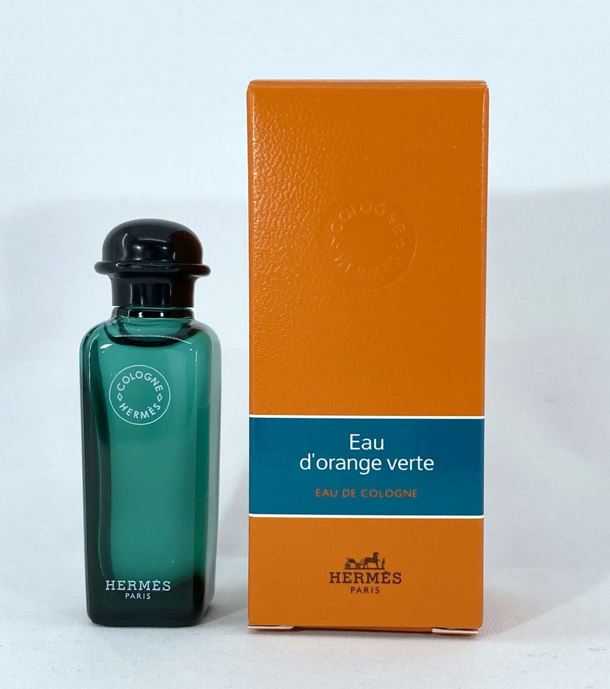 Hermès Eau d'Orange Verte mini splash bottle showing vibrant citrus and woody notes for on-the-go freshness.